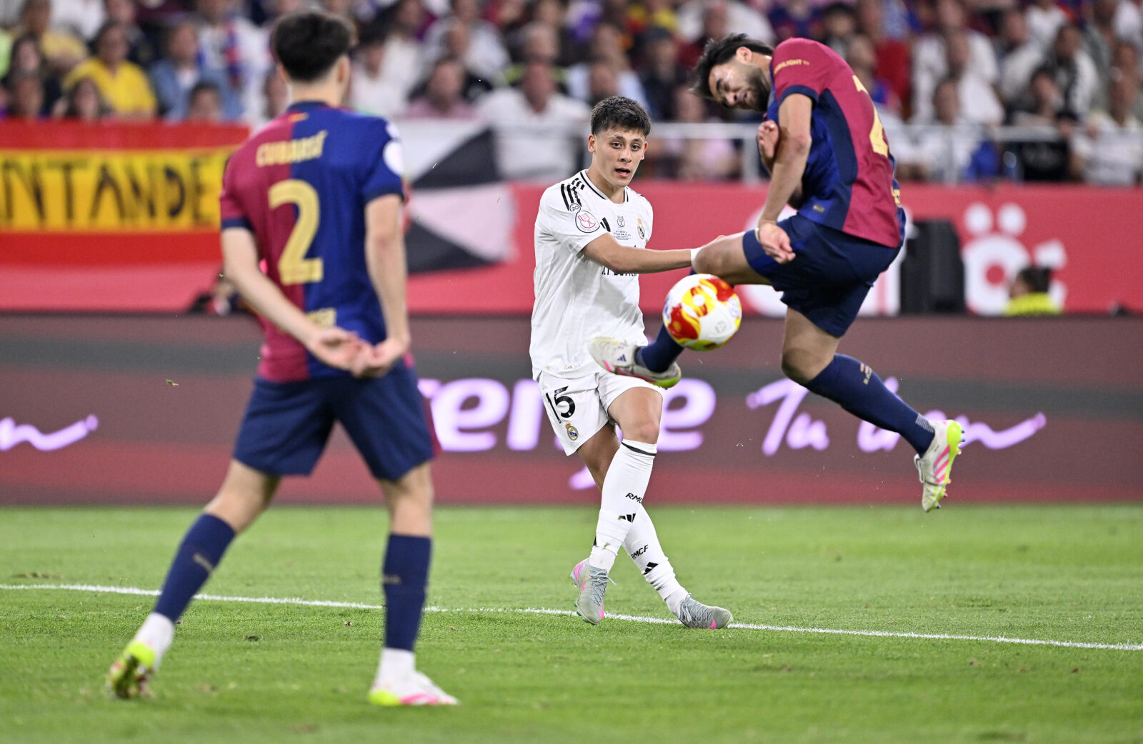 Arda Guler (C) of Real Madrid in action against Eric Garcia (R) of Barcelona during the Copa del Rey 2025 last match between Barcelona and Real Madrid in Seville, Spain on April 26, 2025. (AA Photo)