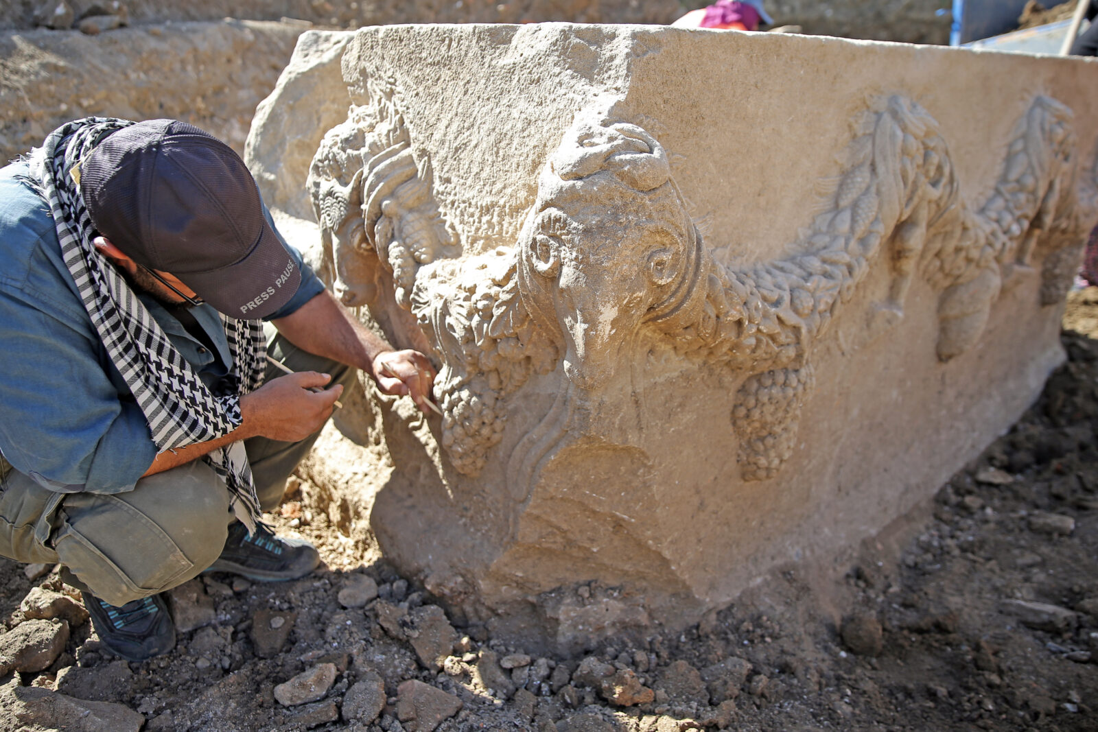 A view of the garlanded sarcophagus, adorned with wreaths made of fruits, flowers, and leaves, after it has been discovered at Stratonikeia ancient city, located in the Yatagan district of Mugla, Türkiye, April 16, 2025. (AA Photo)