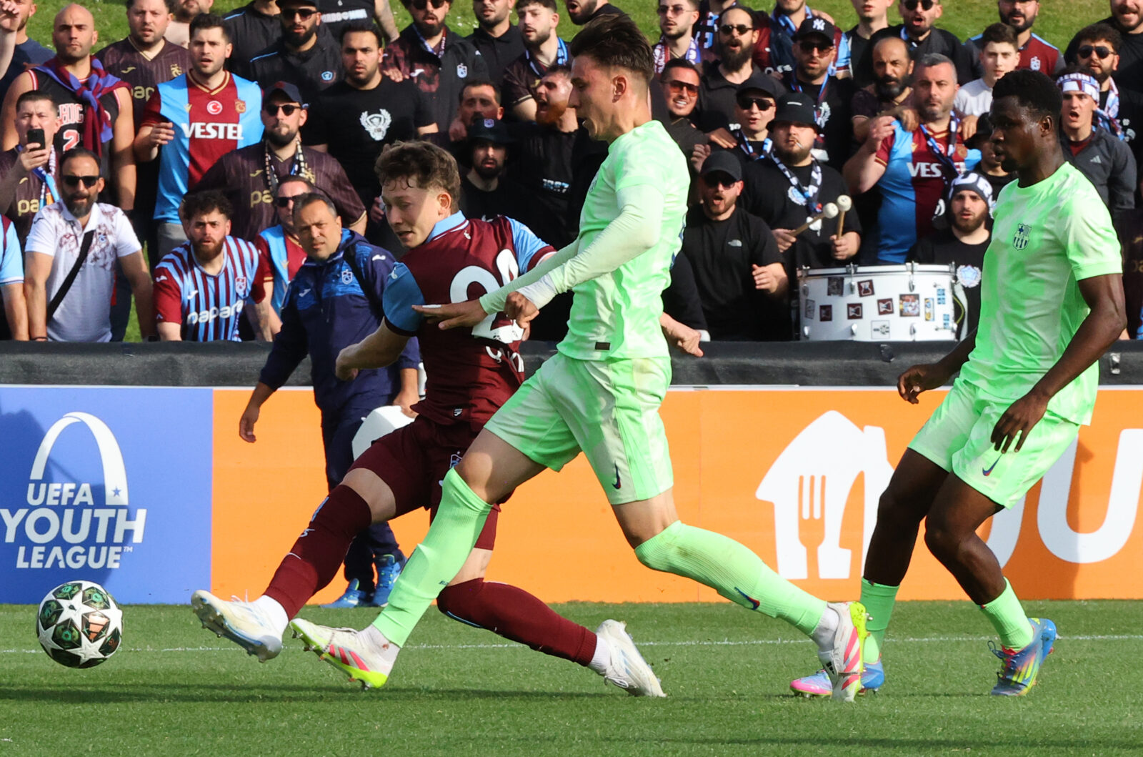 In UEFA Youth League final, Trabzonspor’s Onuralp Cakiroglu battles Barcelona U19 rival at Colovray Sports Center in Nyon, Switzerland, April 28, 2025. (AA Photo)