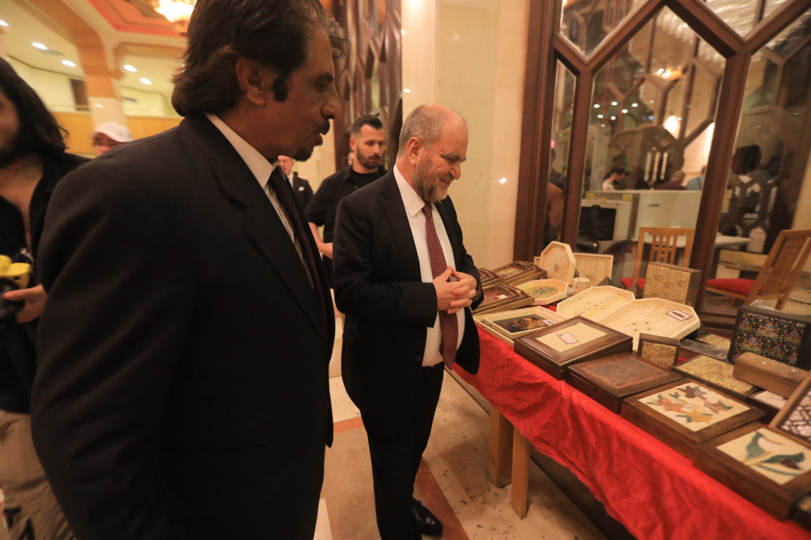 Syrian Minister of Culture Muhammad Salih and Türkiye's Charge d'Affaires in Damascus, Ambassador Burhan Koroglu (R), attended the 