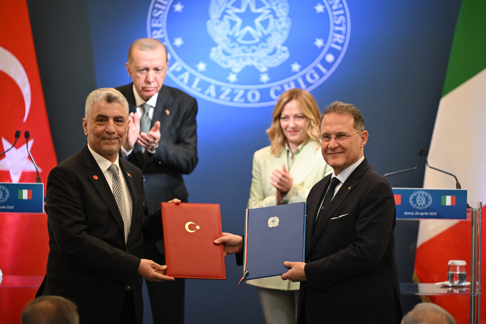 Türkiye's Trade Minister Omer Bolat (L) and Italy’s Deputy Minister of Foreign Affairs and International Cooperation Edmondo Cirelli (R) sign agreements in trade, industrial investments, space, culture, sports, social services, archives, transportation, and defense industries following the Fourth Türkiye-Italy Intergovernmental Summit chaired by President Recep Tayyip Erdogan and Italian Prime Minister Giorgia Meloni in Rome, Italy on 29, 2025. (AA Photo)