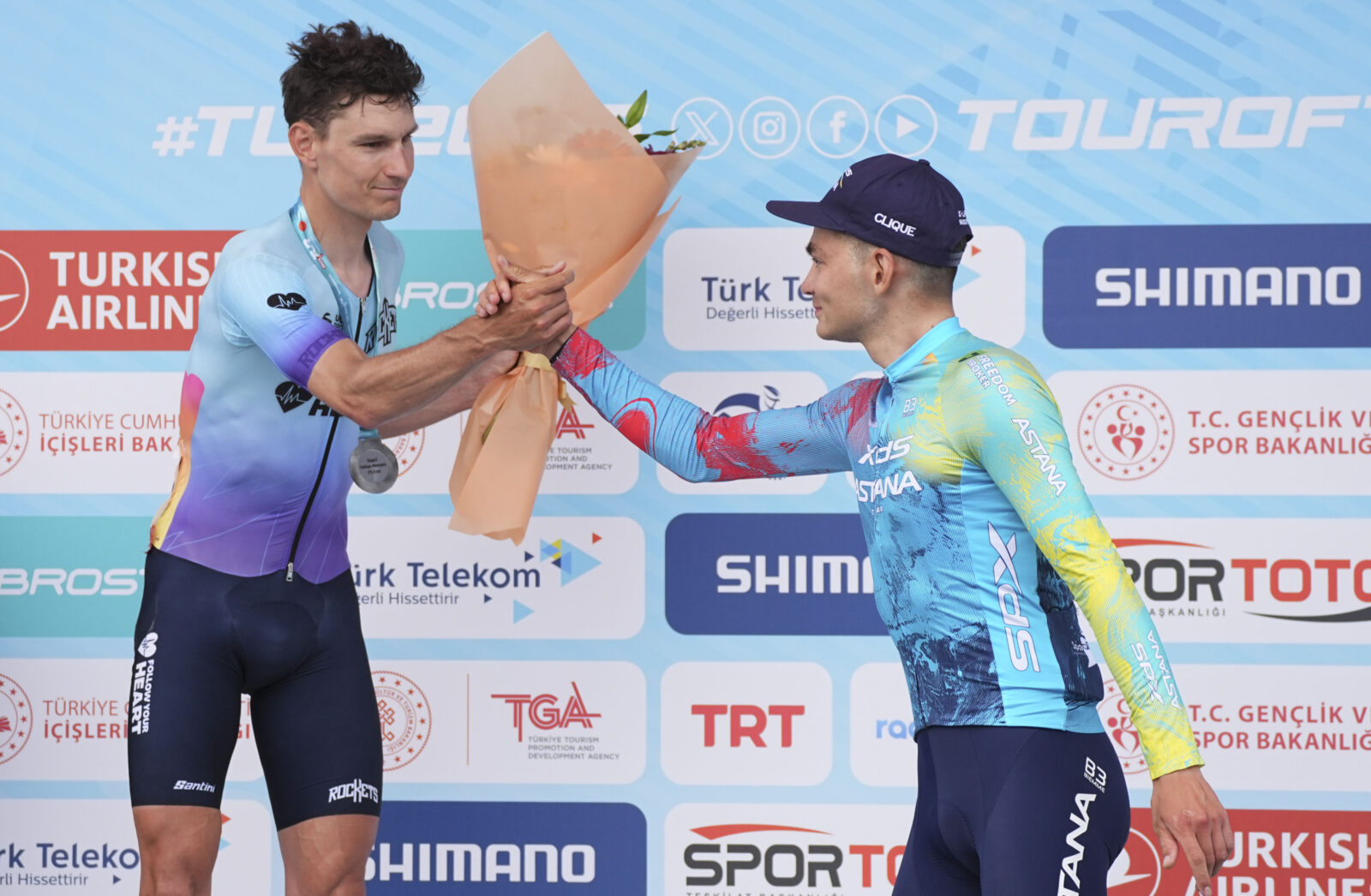 Runner-up Lander Loockx (L) and stage winner Lev Gonov (R) congratulate each other after the race at the 60th Presidential Cycling Tour of Türkiye in Antalya on April 29, 2025. (AA Photo)