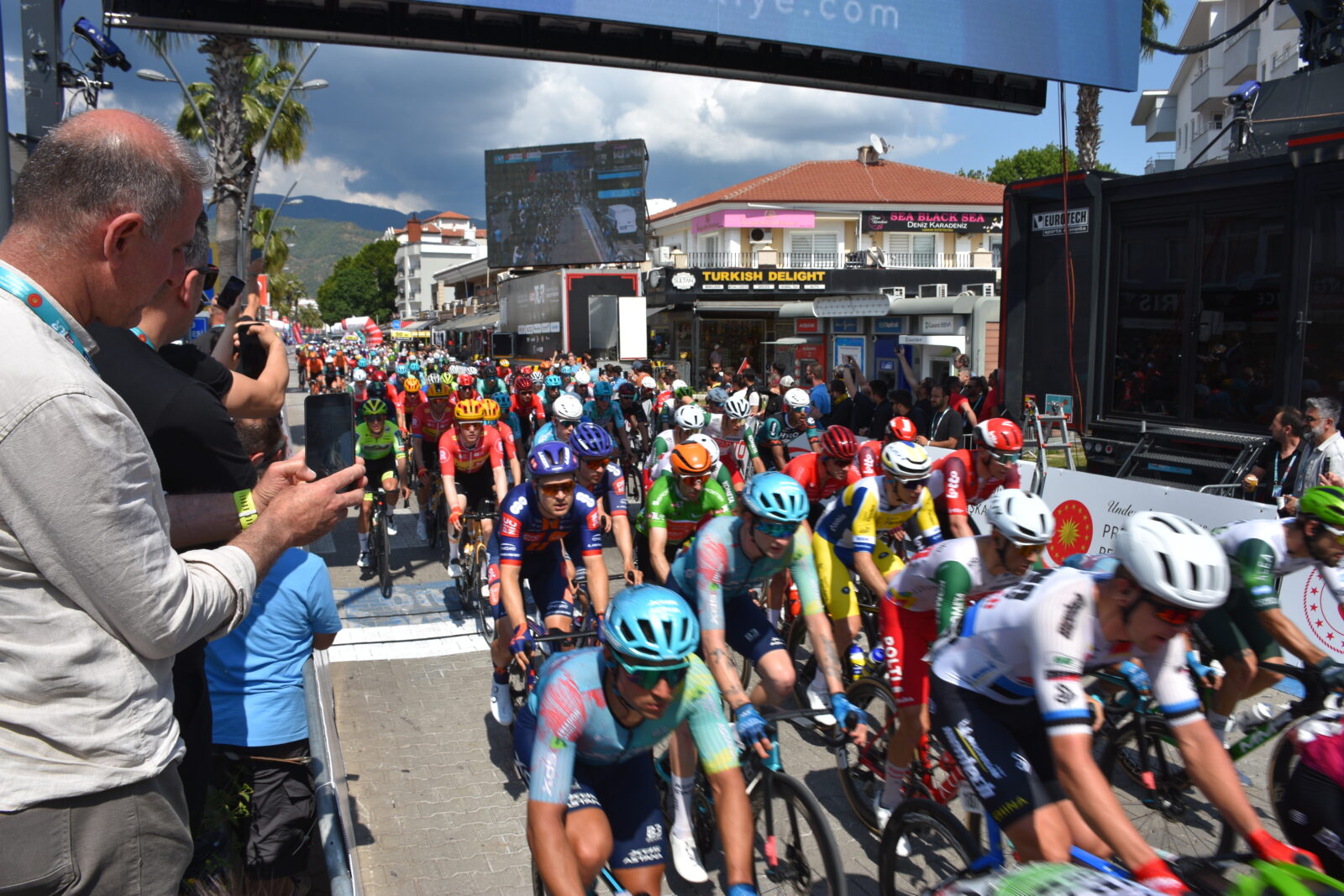 Cyclists cross the finish line during the third and longest stage of the 60th Presidential Cycling Tour of Turkiye (TUR 2025), covering 175.9 kilometers from Fethiye to Marmaris, in Mugla, Türkiye on April 29, 2025. (AA Photo)