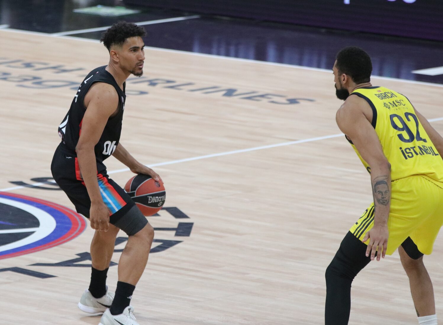 Maodo Lo (12) of Paris Basketball in action against Khem Xavier Birch (92) of Fenerbahce Beko during the Turkish Airlines EuroLeague playoff 3rd match between Paris Basketball and Fenerbahce Beko at Adidas Arena in Paris, France on April 29, 2025. (AA Photo)