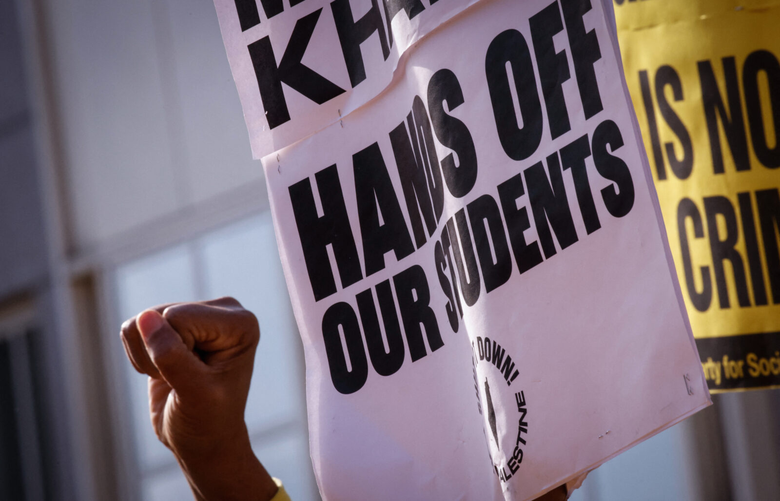People hold signs as they participate in a protest in support of Columbia University student activist Mahmoud Khalil while a hearing takes place, outside the court in Newark, New Jersey, U.S. on March 28, 2025. (AFP Photo)