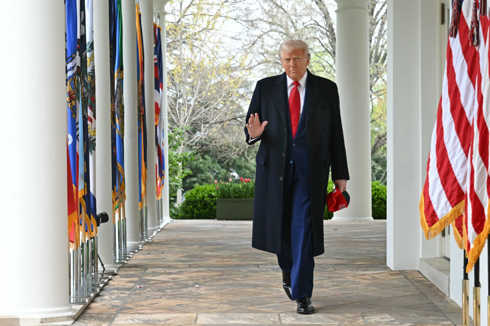 U.S. President Donald Trump waves as he walks to deliver remarks on reciprocal tariffs during an event in the Rose Garden entitled 