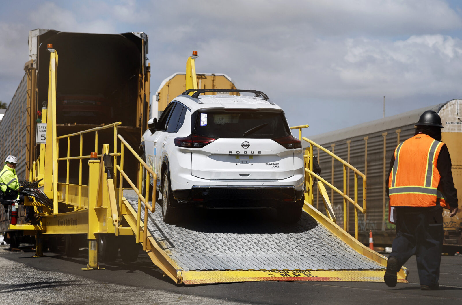 A new Nissan Rogue is driven onto a rail car to be transported from an automobile processing terminal located at the Port of Los Angeles in Wilmington, California, April 3, 2024. (AFP Photo)