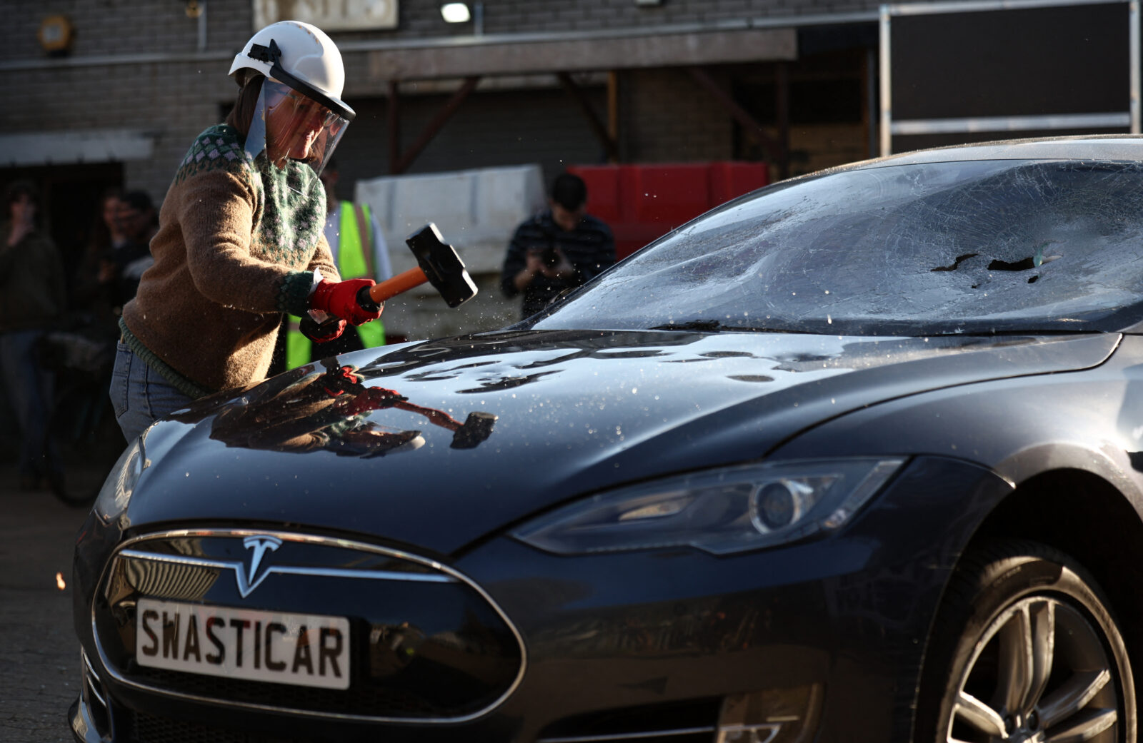 Tesla car burned in London protests by Everyone Hates Elon group