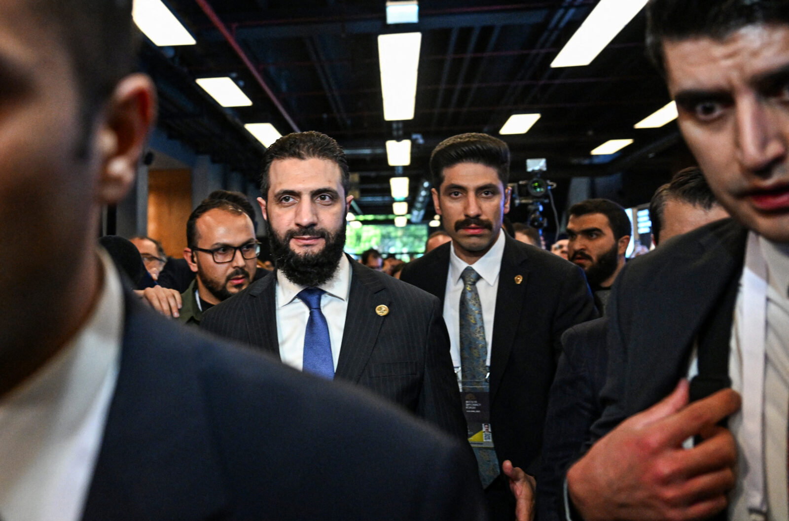 Syria's interim President Ahmad al-Sharaa (C/L) leaves a bilateral room after his meeting with Qatar's Minister of Foreign Affairs during the Antalya Diplomacy Forum, in Antalya, on April 11, 2025. (AFP Photo)