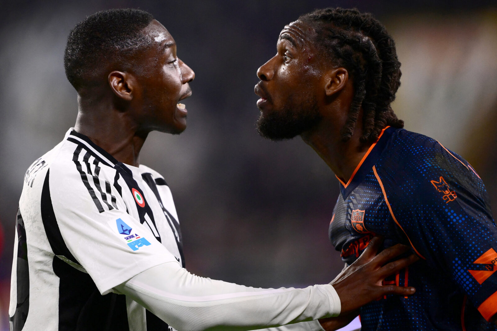 Juventus' French forward #20 Randal Kolo Muani (L) argues with Lecce's Angolan defender #04 Kialonda Gaspar (R) during the Italian Serie A football match between Juventus and Lecce at the 