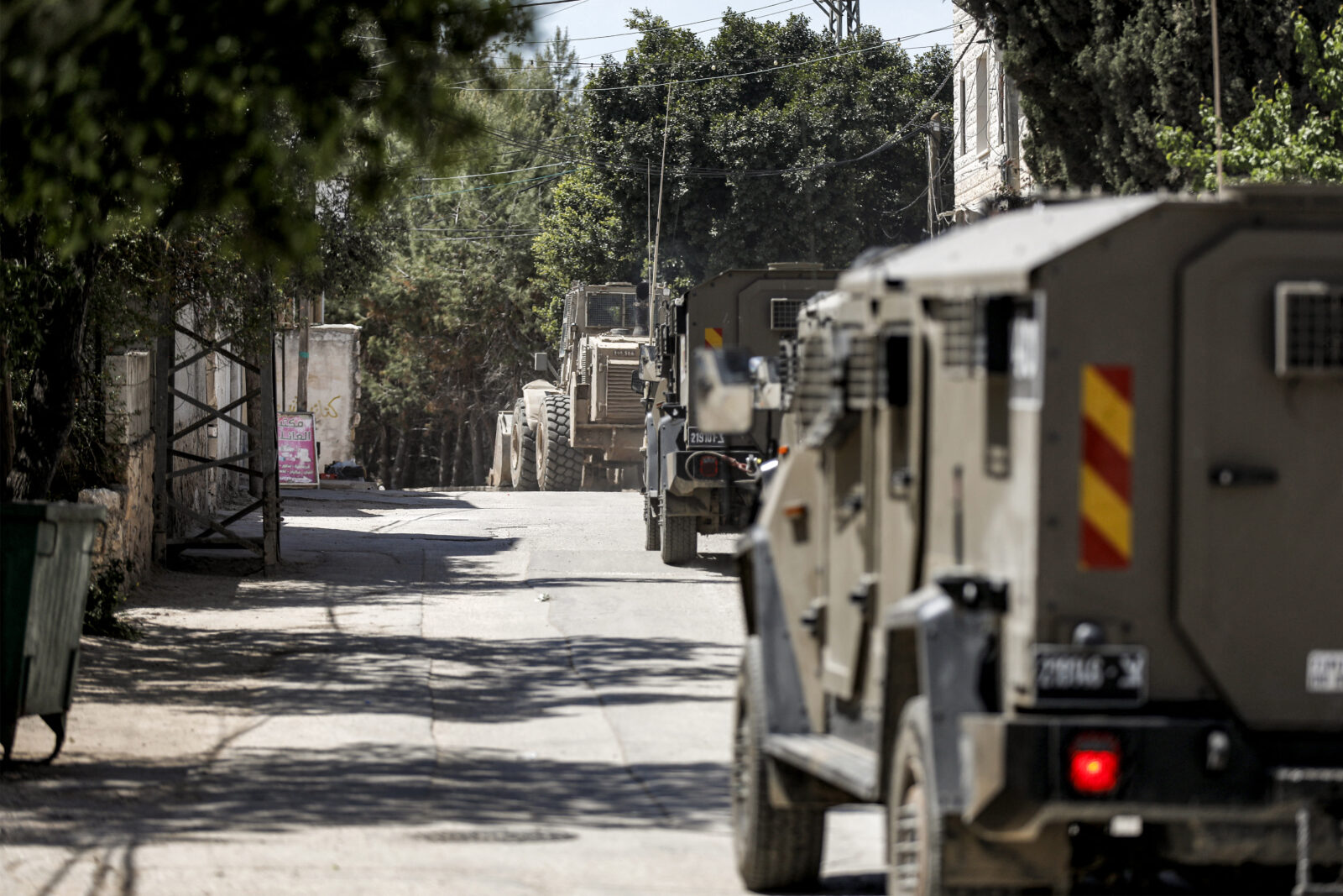 Israeli military armoured vehicles move along a road in a convoy during an army operation in the village of al-Misliyah, south of Jenin in the northern occupied West Bank on April 16, 2025. (AFP Photo)