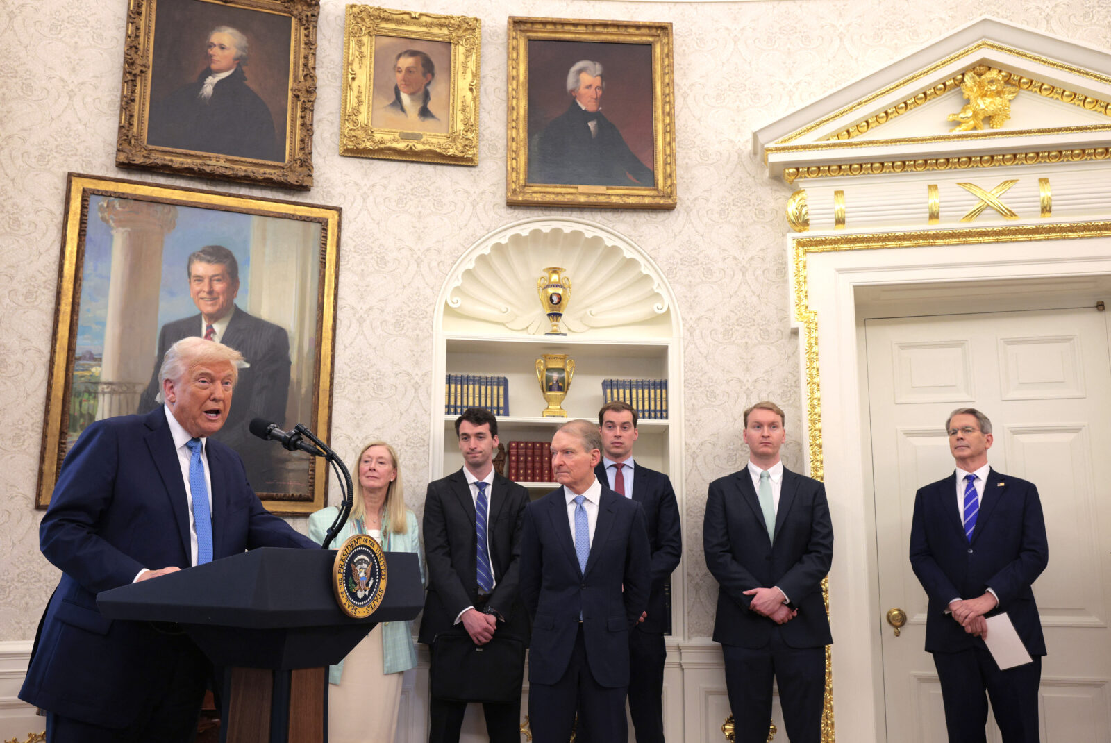 U.S. President Donald Trump delivers remarks during the swearing-in ceremony for Securities and Exchange Commission Chairman Paul Atkins (C) alongside the Atkins family and Treasury Secretary Scott Bessent (R) in the Oval Office at the White House in Washington, D.C, on April 22, 2025. (AFP Photo)