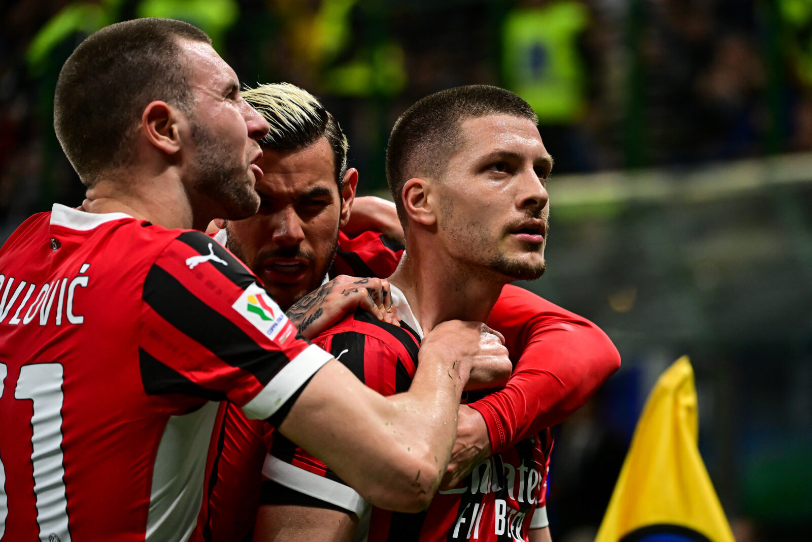 AC Milan's Serbian forward #09 Luka Jovic (R) celebrates with teammates after scoring AC Milan's first goal during the Coppa Italia second leg semi-final football match between Inter Milan and AC Milan at the San Siro stadium in Milan on April 23, 2025. (AFP Photo)