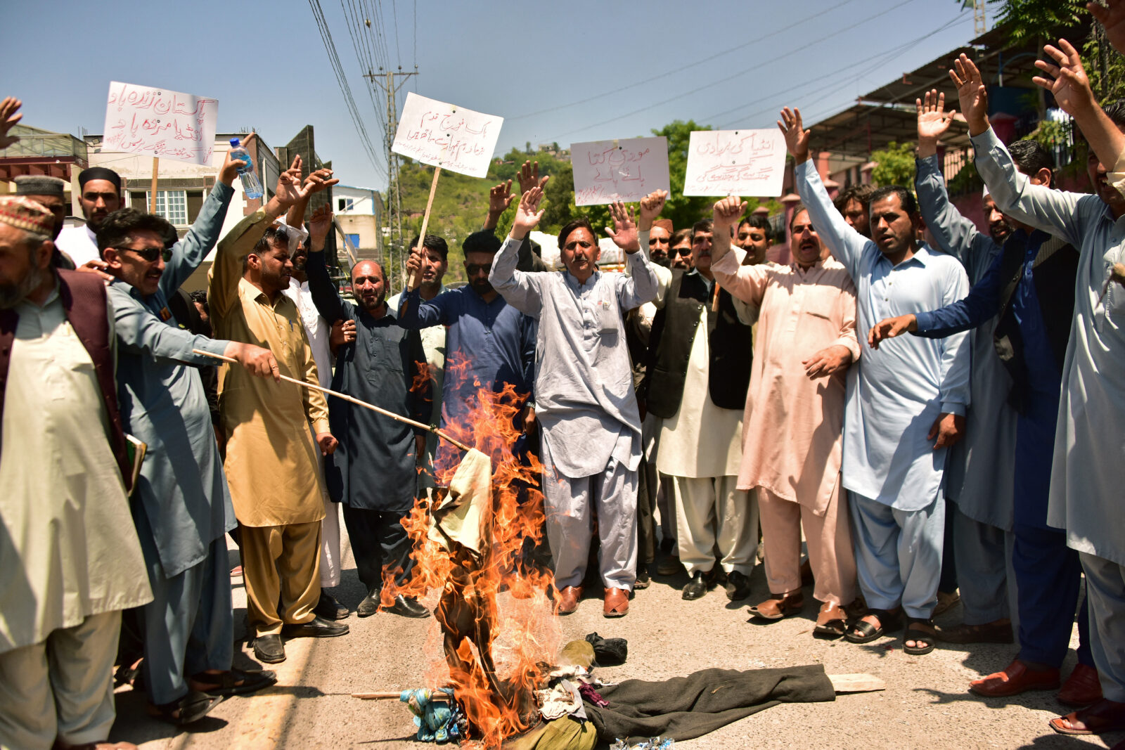 Demonstrators shout slogans and burn an effigy of India's Prime Minister Narendra Modi during an anti-India protest in Muzaffarabad, the capital of Pakistan-administered Kashmir, on April 29, 2025. (AFP Photo)