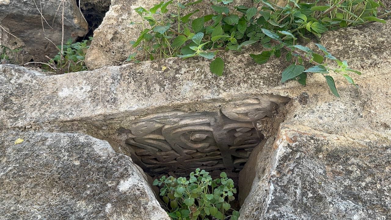Tourists visiting the ancient Roman aqueduct in Iznik, Bursa, Türkiye, discovered an Ottoman-era tombstone, April 6, 2025. (IHA Photo)
