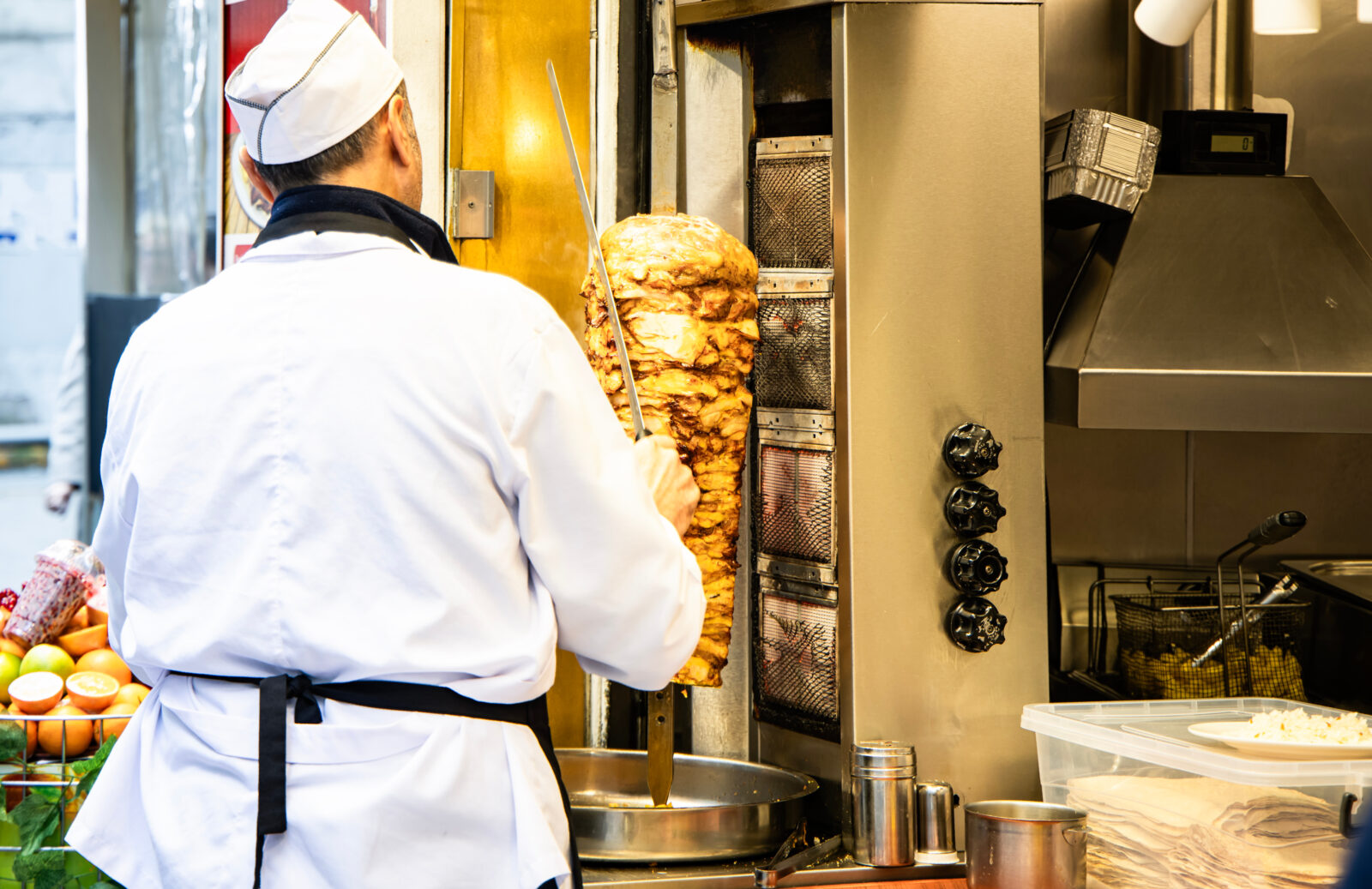 A chef prepares traditional doner kebab at a street food stall in Istanbul, Türkiye, accessed on April 29, 2025. (Adobe Stock Photo)