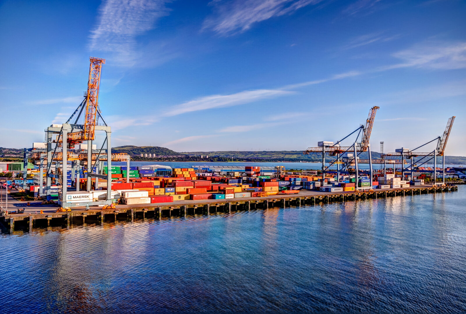 Containers stacked at the busy Port of Belfast commercial terminal in Belfast, Ireland, on July 15, 2019. (Adobe Stock Photo)