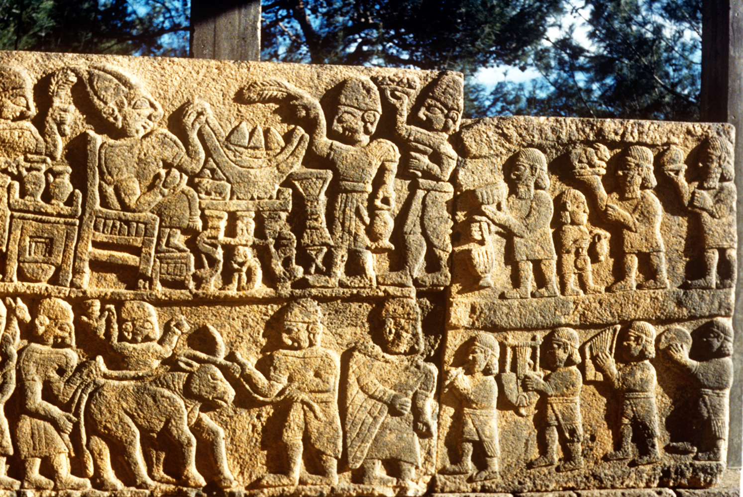 Luwian reliefs depicting a banquet scene, food carriers, and musicians in the right chamber of the south gate of Karatepe-Aslantas, the Luwian citadel near Osmaniye in southern Türkiye. (Photo <a href=