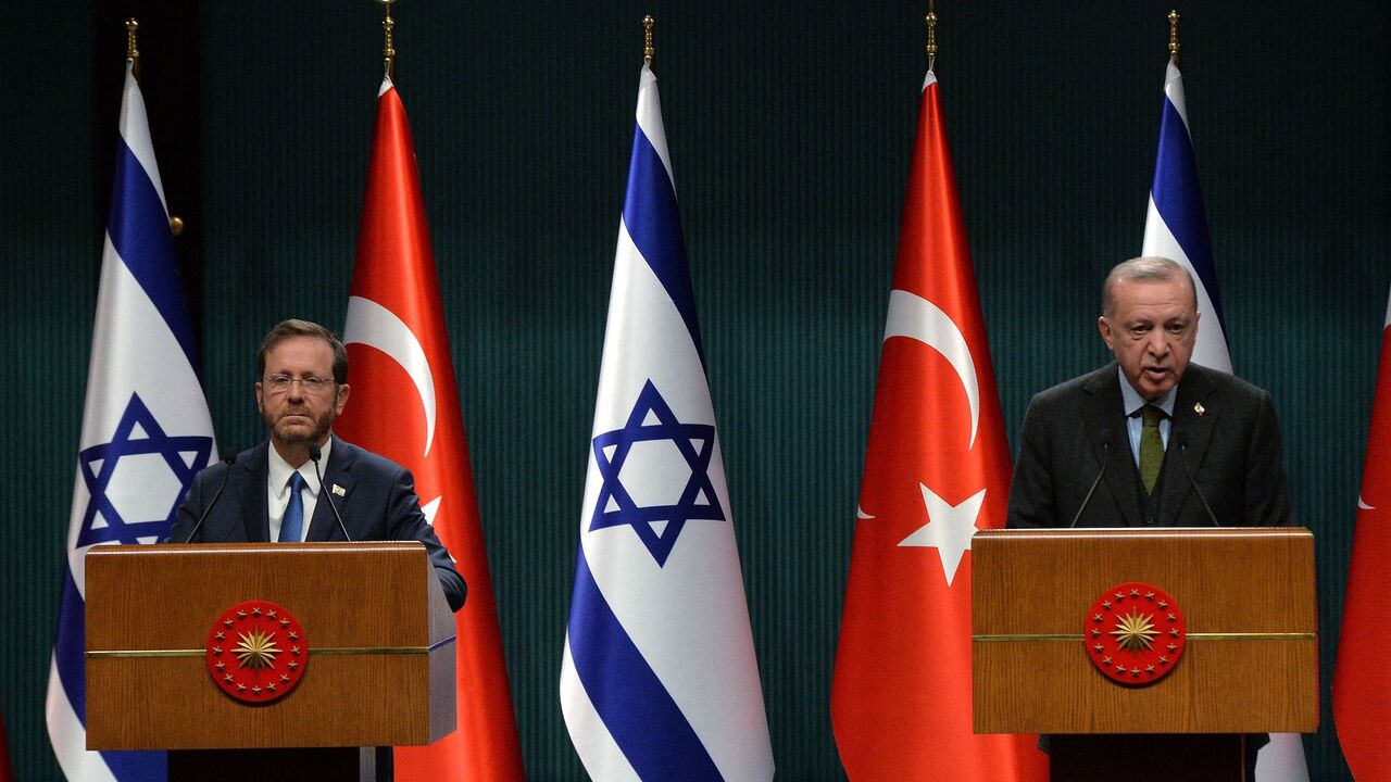 Israeli President Isaac Herzog (L) and his Turkish counterpart Tayyip Erdogan give a press conference in Ankara, on March 9, 2022. (Photo by AFP) (Photo by STR/AFP via Getty Images)