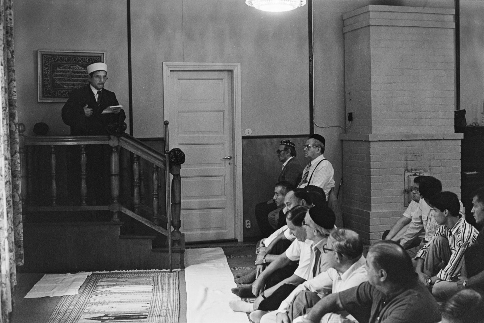 Imam Enver Yildirim and Finnish Tatars during a prayer service at the Jarvenpaa mosque, Finland, August 1989. (Photo via Finnish Heritage Agency)