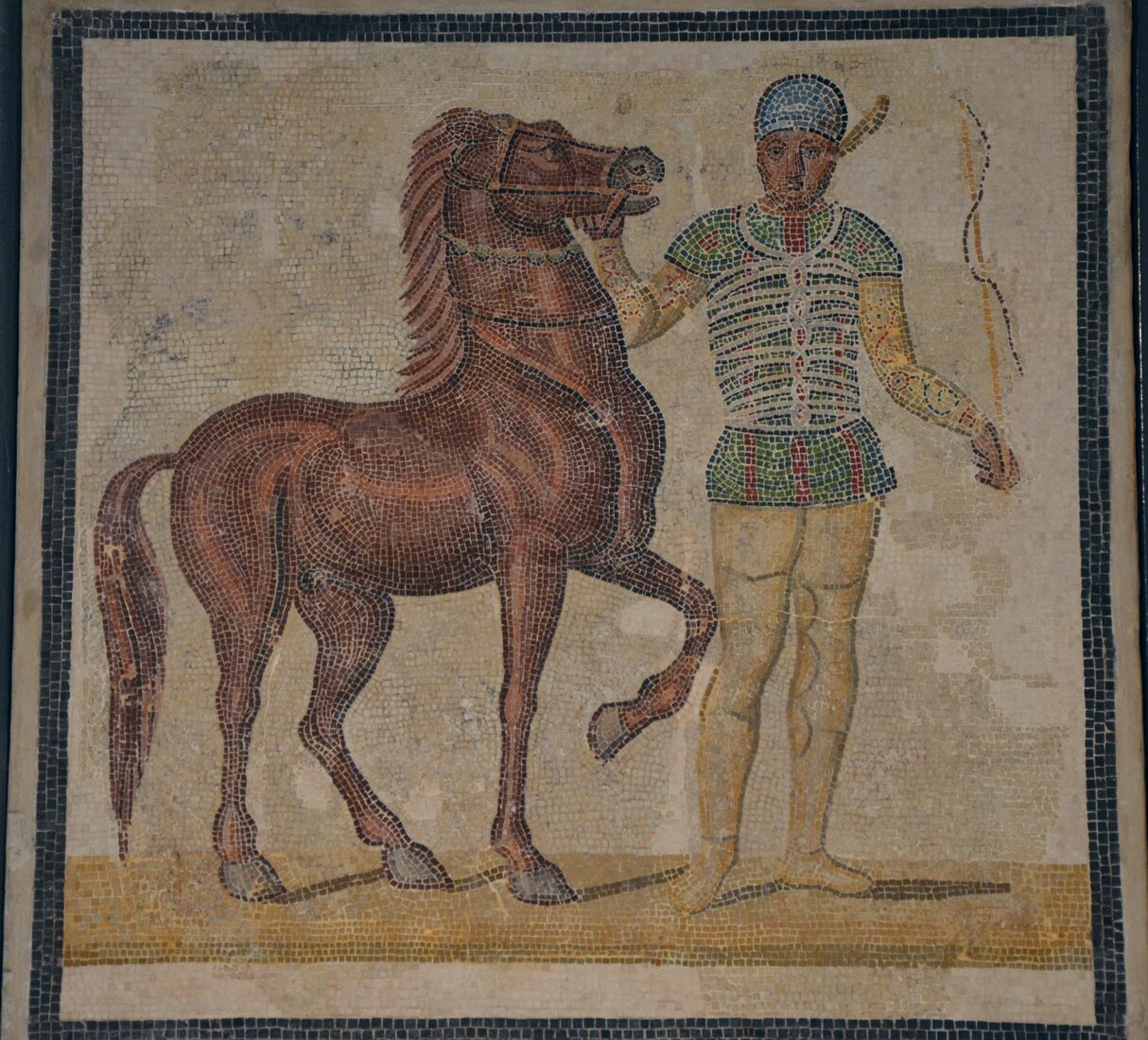Mosaic depicting a charioteer and horse from the Prasina faction (Green), third century A.D., Palazzo Massimo all Terme, Rome, Italy. (Photo via Wikimedia)