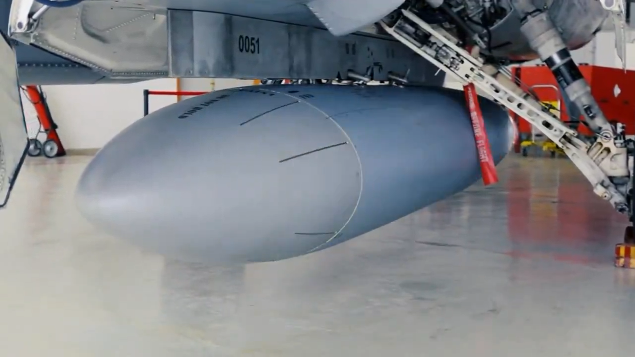 F-16 EDPOD mounted on the external pod similar to the 300-gallon external fuel tank carried beneath the F-16 fuselage, can be seen during the video released on Apr 11, 2025. (Screengrab photo via X / @mfatihkacir)