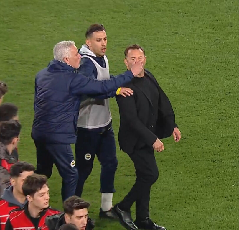 Fenerbahce head coach Mourinho approaches Galatasaray’s Buruk on the field, grabs his nose, and causes the Galatasaray coach to lose balance and fall at Ulker Stadium in Istanbul, Türkiye on April 2, 2025. (Photo via Türkiye daily)