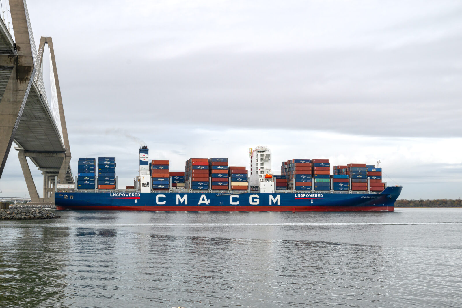 The CMA CGM Ambition, a Post-Panamax class container ship, sails under the Ravenel Bridge as it enters Charleston Harbor in South Carolina, U.S, on Dec. 17, 2024. (Adobe Stock Photo)