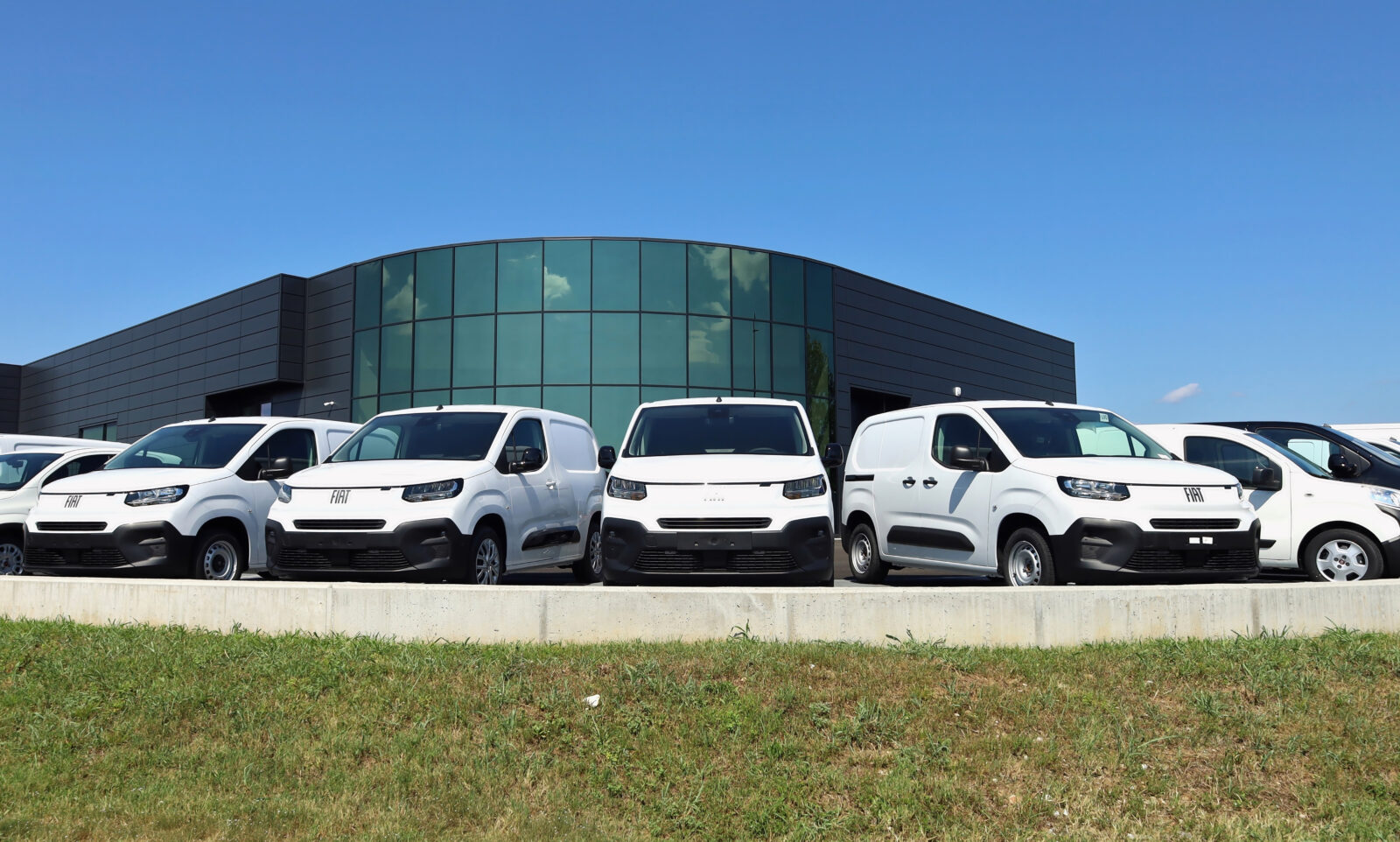 New Fiat commercial vehicles lined up outside an official dealership in Tavagnacco, Italy, on July 30, 2024. (Adobe Stock Photo)