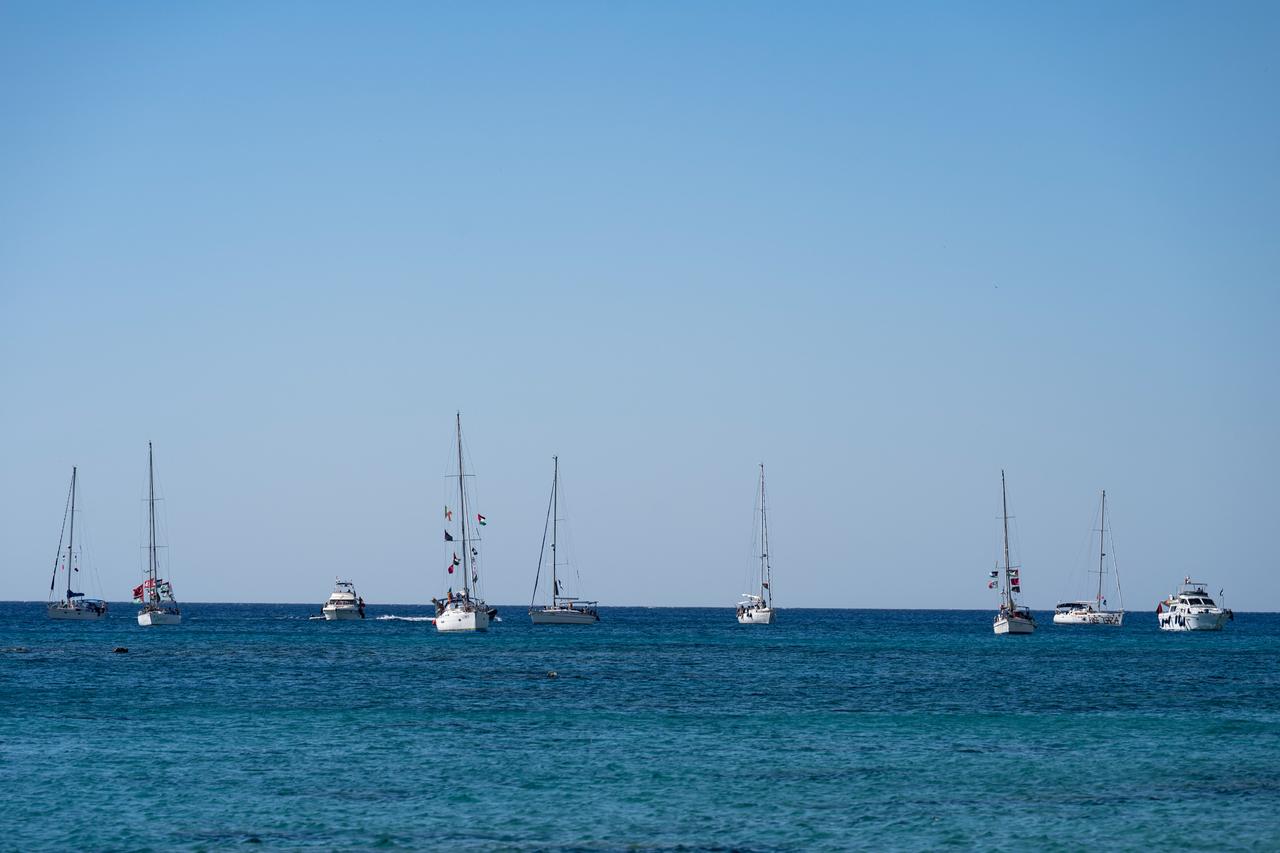 A group of ships of the Global Sumud Flotilla to Gaza are shown moored at the small island of Koufonisi, south of the island of Crete on September 26, 2025. (AFP Photo)