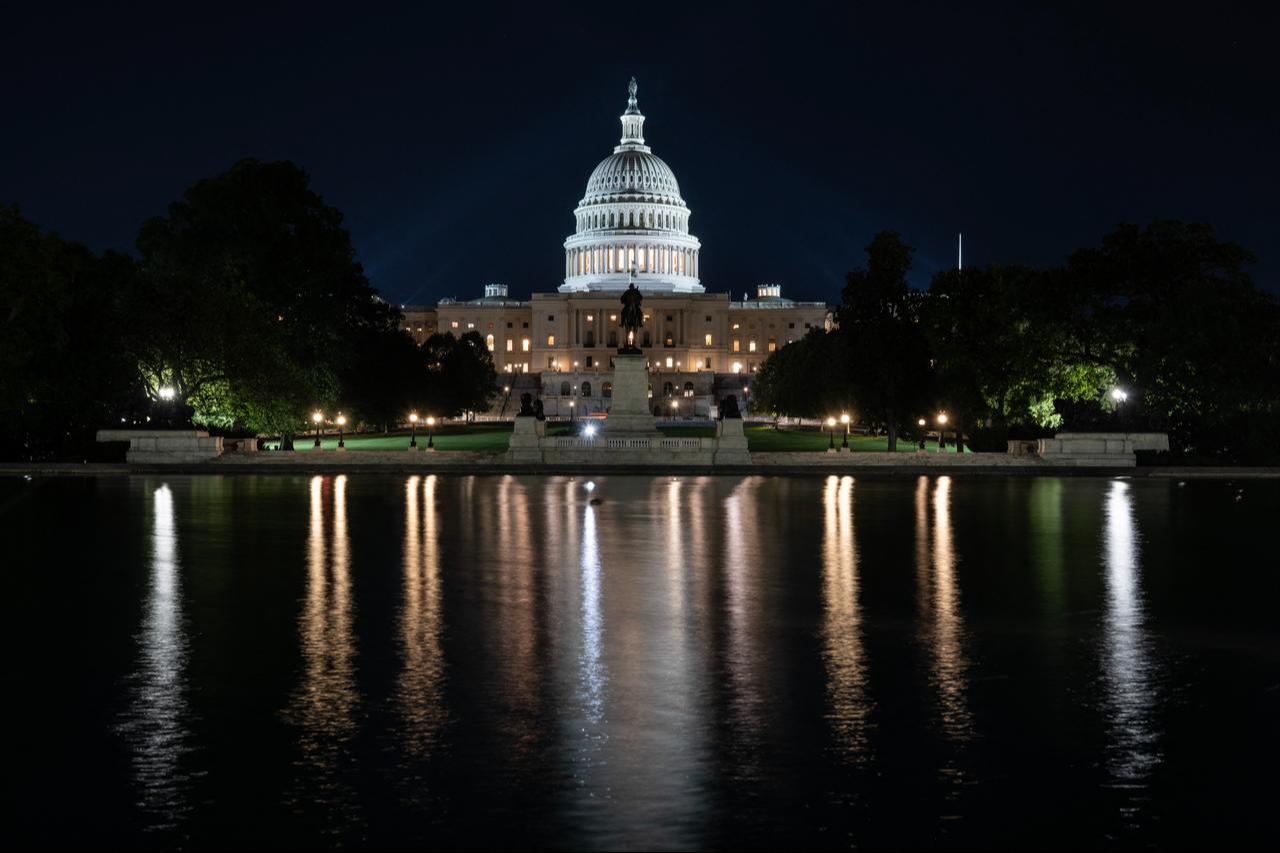 The U.S. Capitol is seen lit up hours before a partial government shutdown is set to take effect in Washington, DC, September 30, 2025. (AFP Photo)