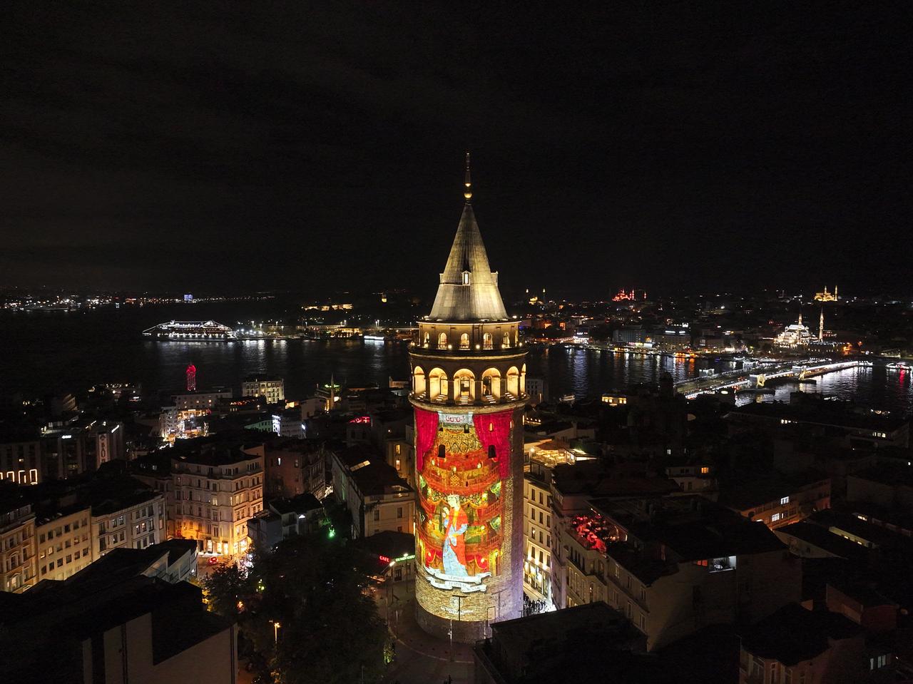 An aerial view of Galata Tower illuminated with video mapping onto its facade within the Istanbul Culture Road Festival organized under the coordination of the Ministry of Culture and Tourism, Istanbul, Türkiye, Sept. 30, 2025. (AA PHoto)