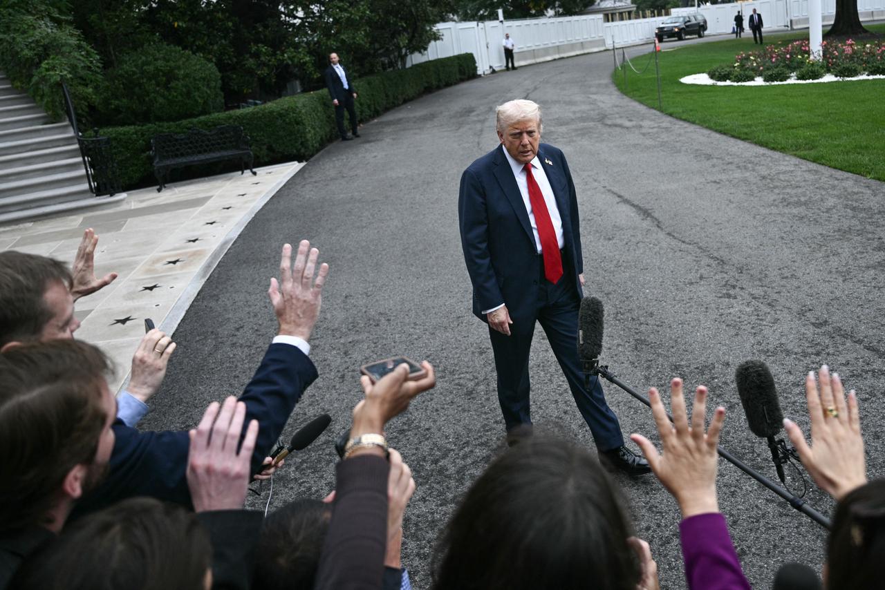 US President Donald Trump speaks to the press before boarding Marine One as he departs from the South Lawn of the White House in Washington, DC, Sept. 30, 2025. (AFP Photo)