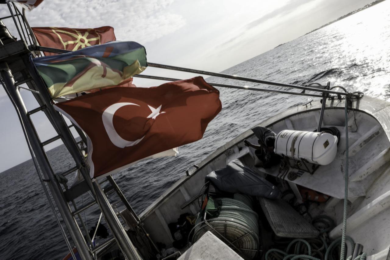 A view of flags hung in the flagship of the Global Sumud Fleet, the vessel named ‘Family’, as the vessel anchors in Porto Palo Bay in Sicily, Italy on Sept. 18, 2025. (AA Photo)