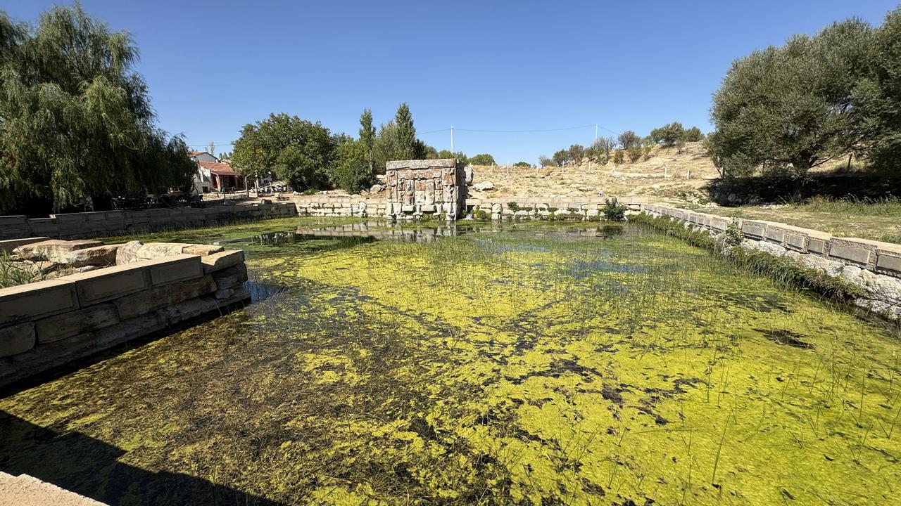 The sacred pool and the monumental façade of the Eflatunpinar Hittite spring sanctuary reflecting in the spring water, Konya, Türkiye, Oct. 10, 2025. (AA Photo)