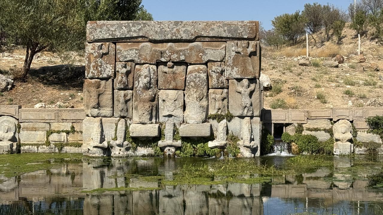The relief-decorated façade of the Eflatunpinar Hittite spring sanctuary standing over its spring-fed pool, Konya, Türkiye, Oct. 10, 2025. (AA Photo)