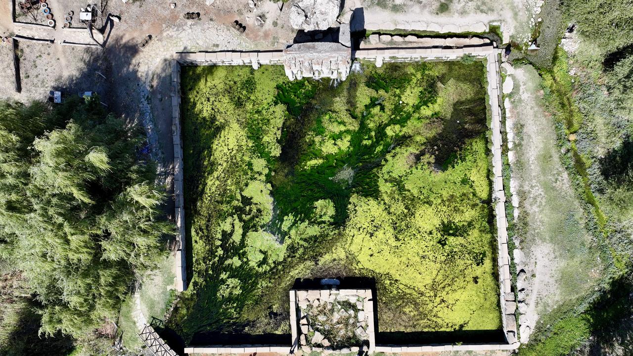 An aerial view of the Eflatunpinar Hittite spring sanctuary and visitors gathering around the 3,200-year-old sacred pool, Konya, Türkiye, Oct. 10, 2025. (AA Photo)