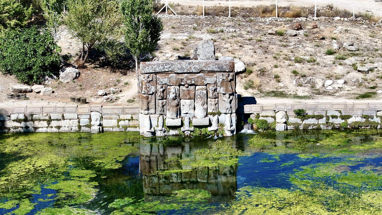 The relief-decorated façade of the Eflatunpinar Hittite spring sanctuary standing over its spring-fed pool, Konya, Türkiye, Oct. 10, 2025. (AA Photo)