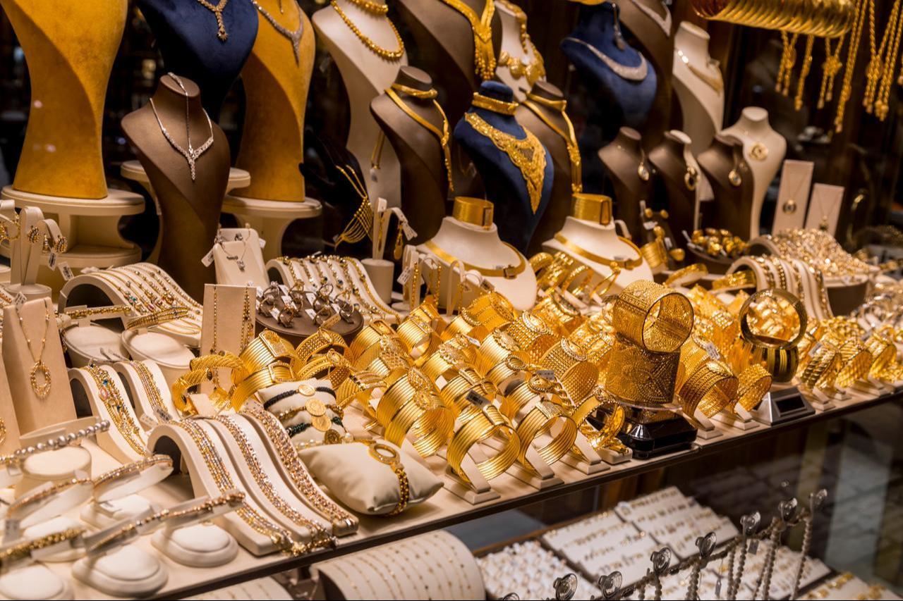 Variety of golden accessories showcased in a shop window at the famous Covered Bazaar (Kapalicarsi) of Bursa, Türkiye on December 27, 2019. (Adobe Stock Photo)