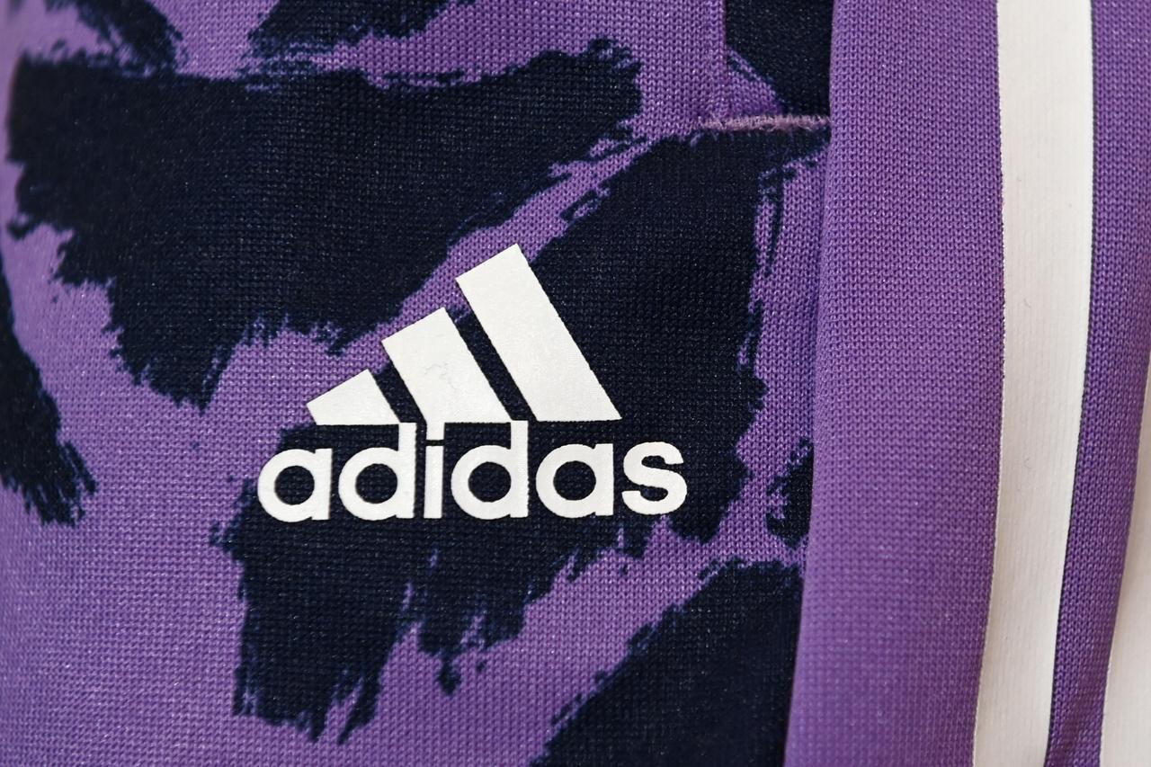 The Adidas logo is pictured before the companys annual press conference in Herzogenaurach, southern Germany, March 8, 2023. (AFP Photo)