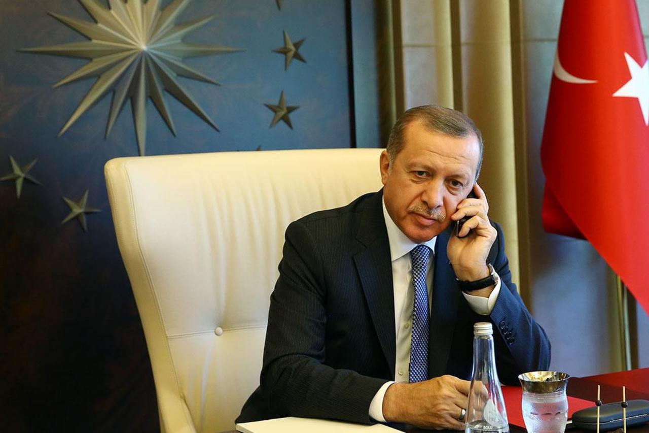 President Recep Tayyip Erdogan speaks on the phone at the Presidential Complex in Ankara, Türkiye. (AA Photo)