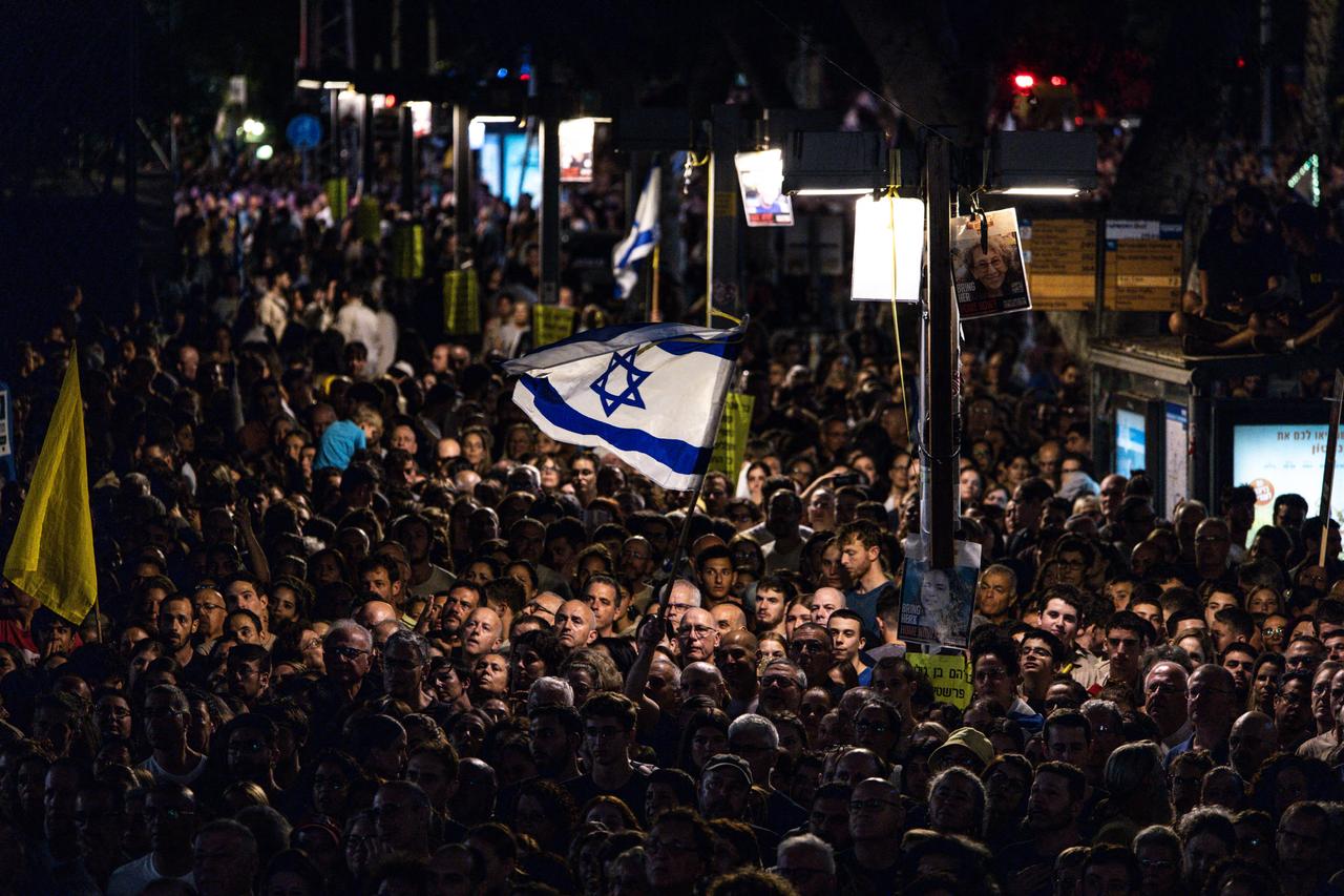 People take part in a gathering at Hostages Square in Tel Aviv on October 11, 2025. (AFP Photo)