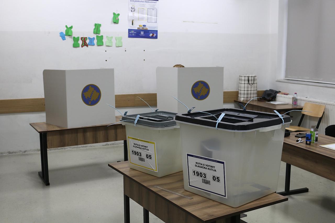 Transperrant ballot boxes are seen as citizens gather to cast their vote at a polling station to elect mayors and municipal assembly members in Pristina, Kosovo on Oct. 12, 2025. (AA Photo)