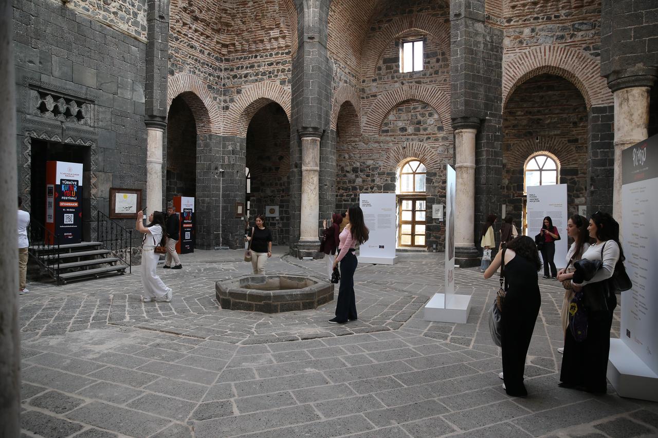 Visitors tour the “Pablo Picasso: Creation Is Everything” exhibition at the 1,800-year-old Saint George Church, one of the key venues of the Diyarbakir Culture Route Festival, Oct. 12, 2025. (AA Photo)