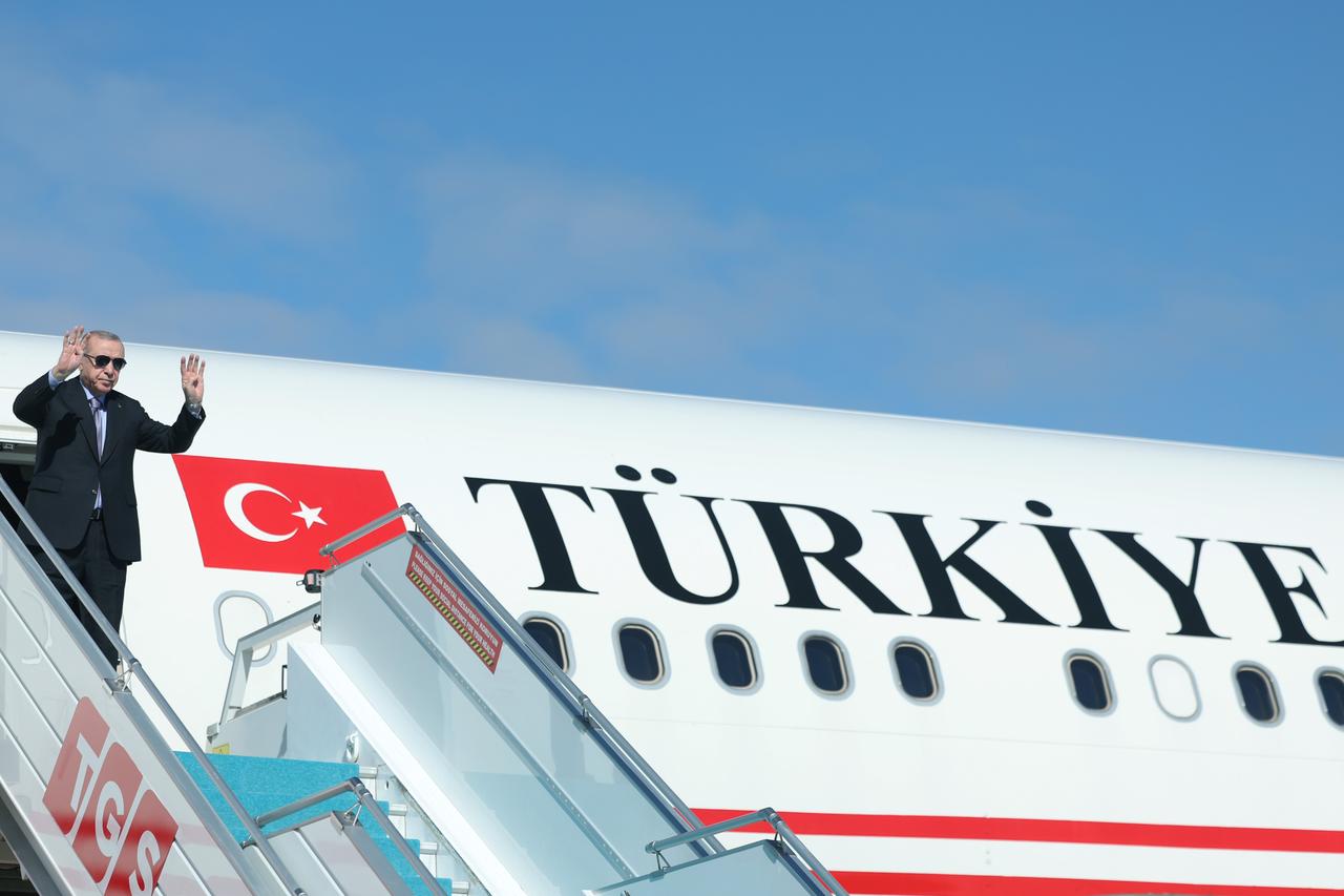 Turkish President Recep Tayyip Erdogan greets officials as he departs for the Egypt to attend the Sharm El Sheikh Peace Summit at the Esenboga Airport in Ankara, Türkiye on Oct. 13, 2025. (Turkish Presidency / AA Photo)