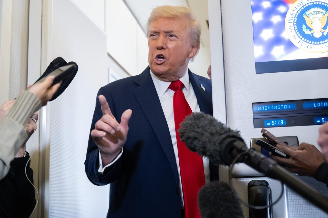 U.S. President Donald Trump speaks with the media aboard Air Force One as he flies from Washington, to Israel, Oct. 12, 2025. (AFP Photo)