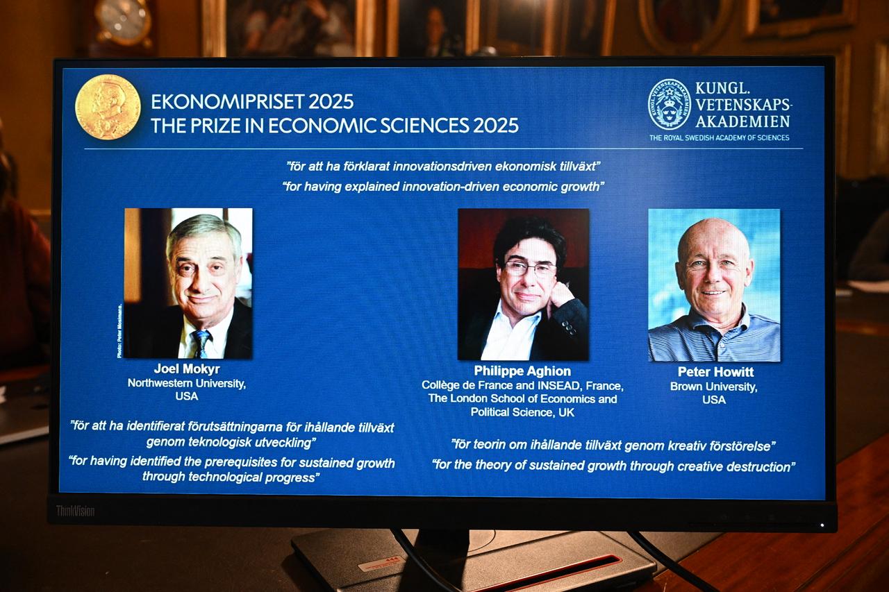 A screen displays the portraits of the 2025 prize winners (L-R) Joel Mokyr, Philippe Aghion, and Peter Howitt, during the announcement at the Royal Swedish Academy of Sciences in Stockholm, Sweden, on October 13, 2025. (AFP Photo)