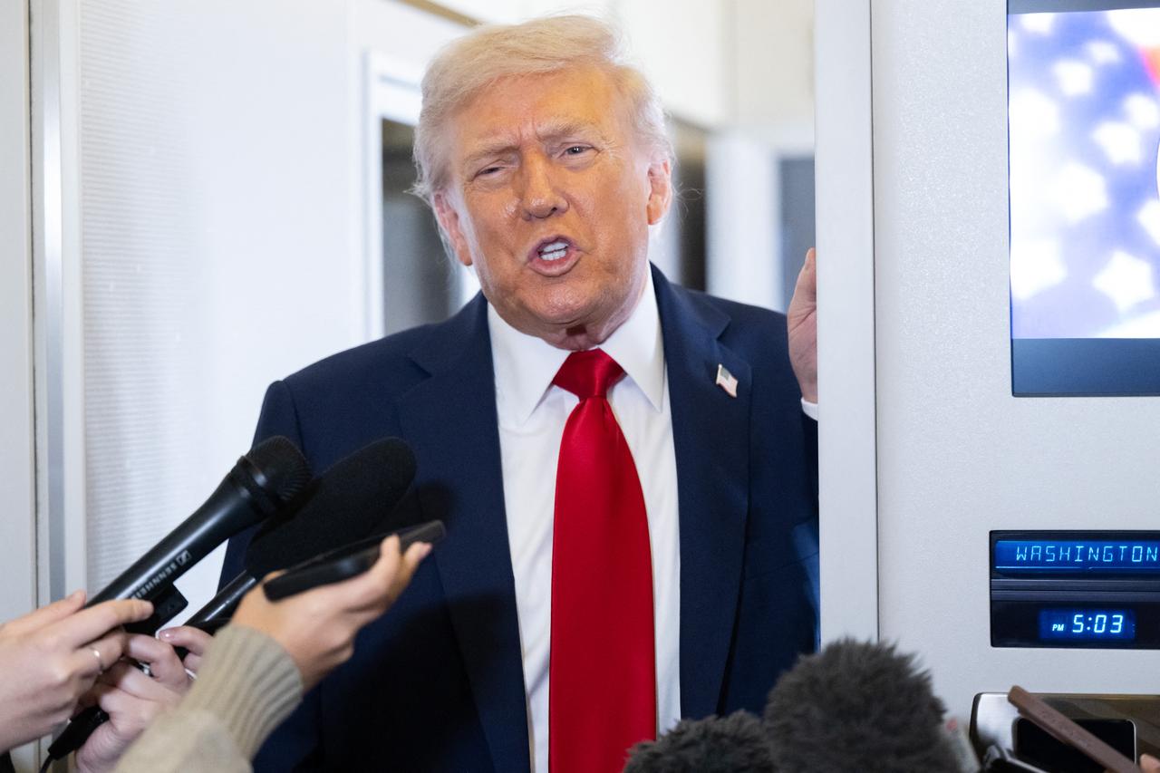 US President Donald Trump speaks with the media aboard Air Force One as he flies from Washington, DC to Israel, October 12, 2025. (AFP Photo)