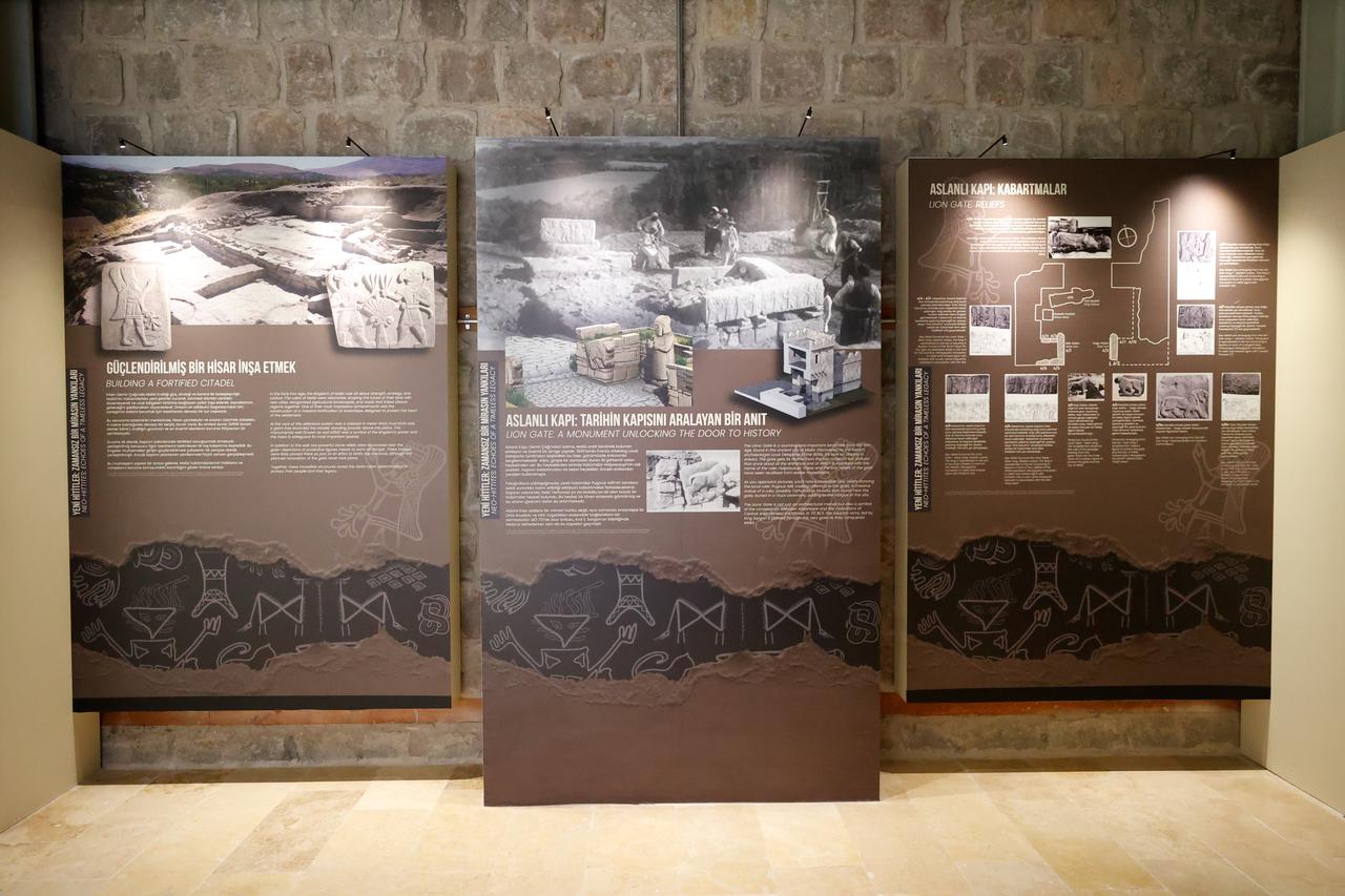 Panels inside the Arslantepe Hoyuk Welcome Center display detailed information on the Lion Gate and Bronze Age fortifications, Malatya, Türkiye, Oct. 12, 2025. (AA Photo)