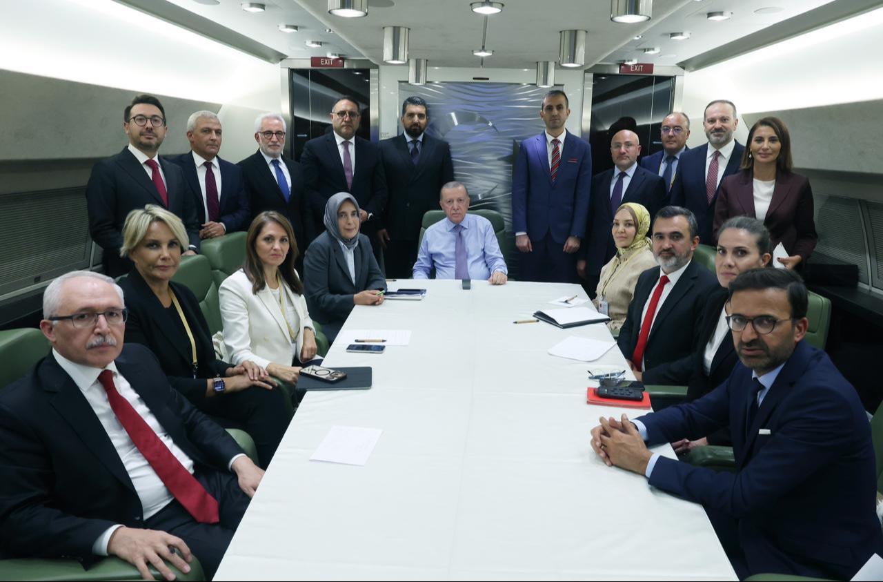 President Erdogan (C) makes statements and answers questions from journalists on the plane during his return following the Sharm el-Sheikh Peace Summit, Oct. 14, 2025. (Photo via Turkish Presidency/Mustafa Kamaci)